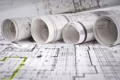 Blueprints rolled up and laid flat